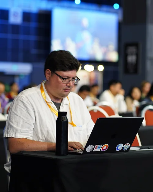 James Forrester working at Wikimania 2023