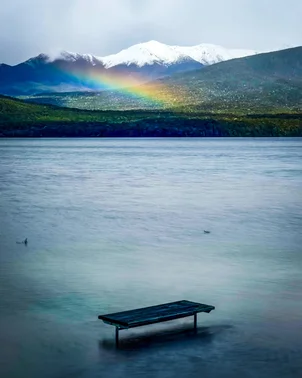 Rainbow over flooded bench
